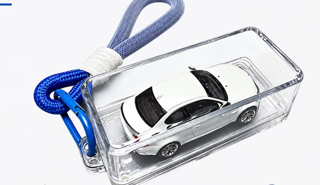 Kicar Pocket Case with a white 1:64 car inside and a blue keychain strap